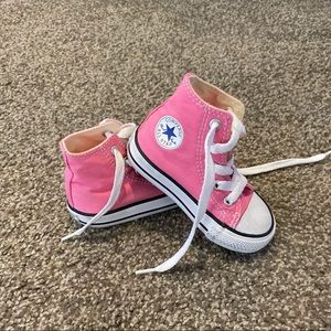 Toddler Pink High Top Chuck Taylors.